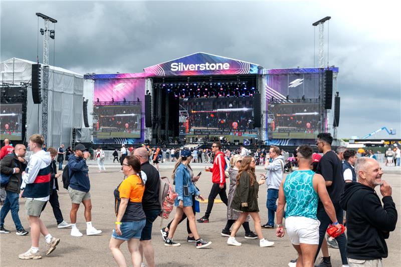 Main Silverstone entertainment stage with crowds gathering for live music during F1 weekend